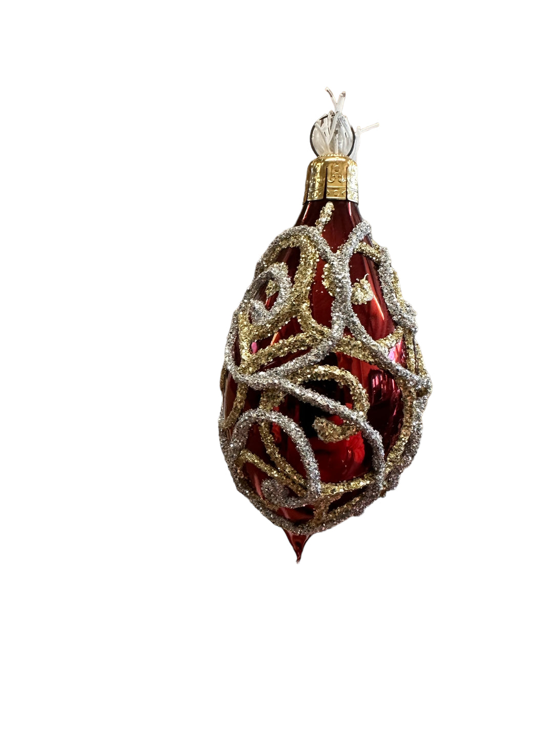 Teardrop-shaped red gold ornaments with swirling gold and silver glitter filigree.