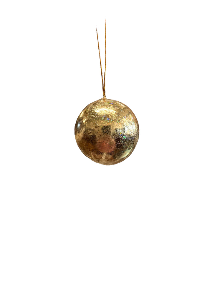Round, textured Gold Ornament on a gold string.