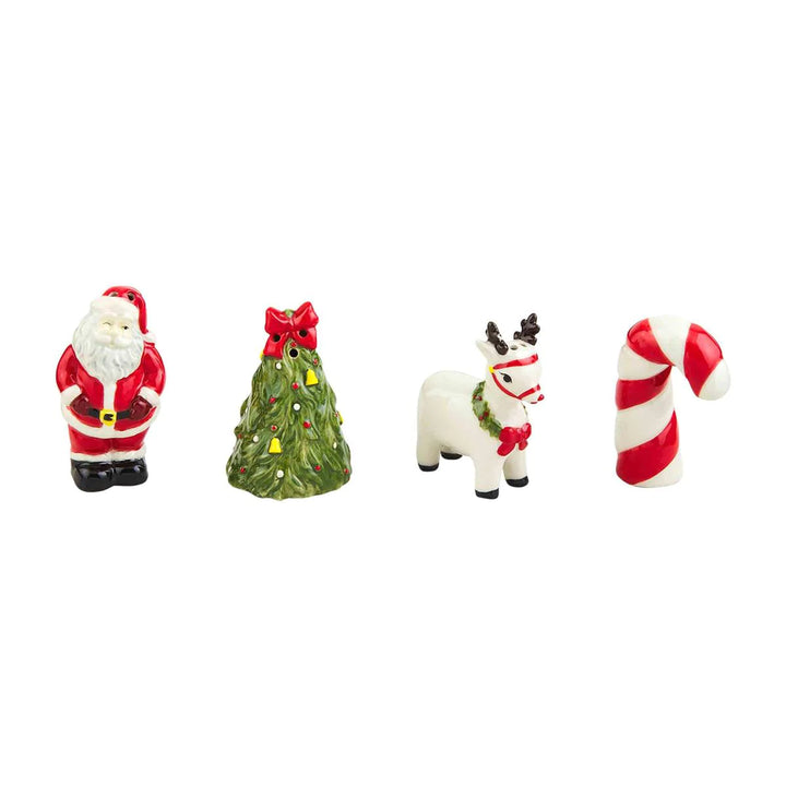 Vintage Christmas ceramic salt and pepper shaker set of four, shaped as Santa Claus, pine tree, reindeer, and candy cane.