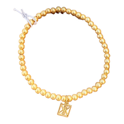 Matte Gold Bracelet: Hypoallergenic stretch bracelet with gold beads, engraved square charm. Available in S, M, L.
