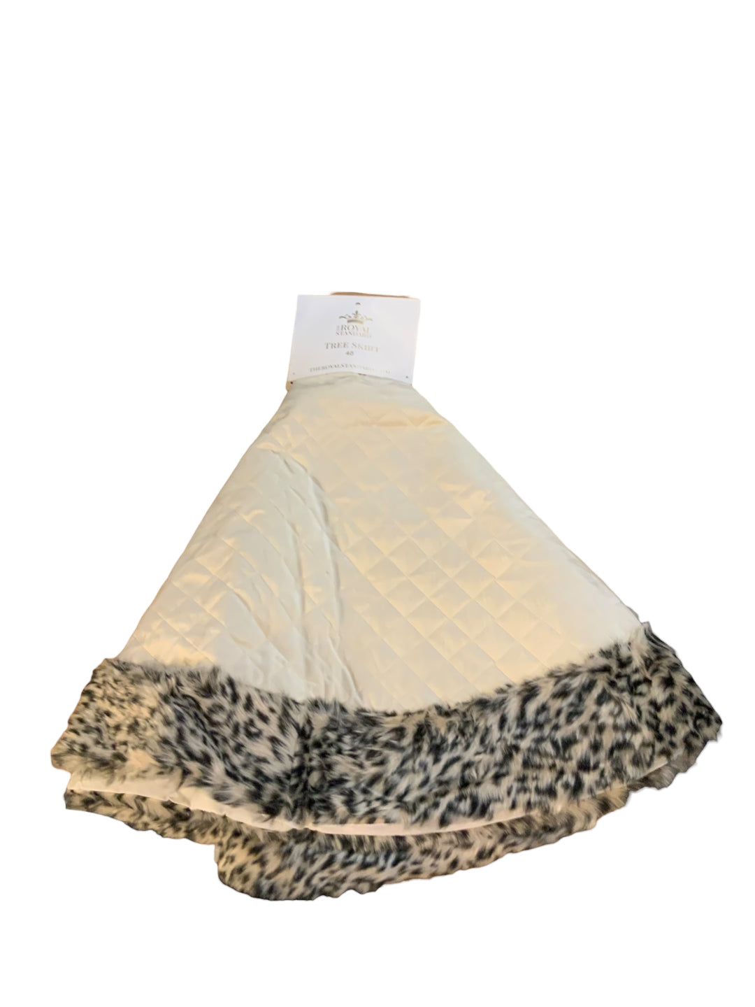 Quilted white tree skirt with faux fur cheetah print border.