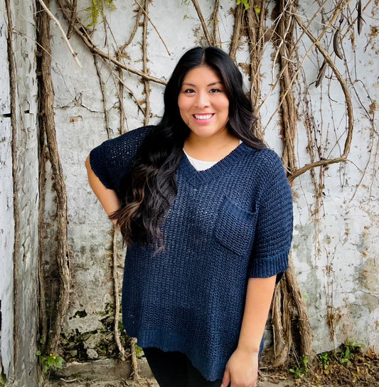 Theo V-Neck Sweater with a classic neckline, available in sizes XS–XL.