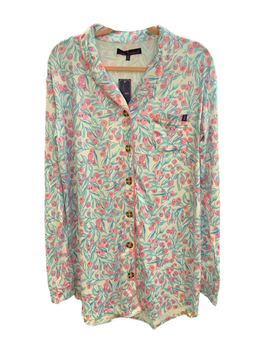 The PJ Pink Berries Blouse is adorned with a whimsical multi-colored leaf and berry design against a light background. It features long sleeves, button closures, and an elegant collar. The sizes available for this product range from small to XXL.