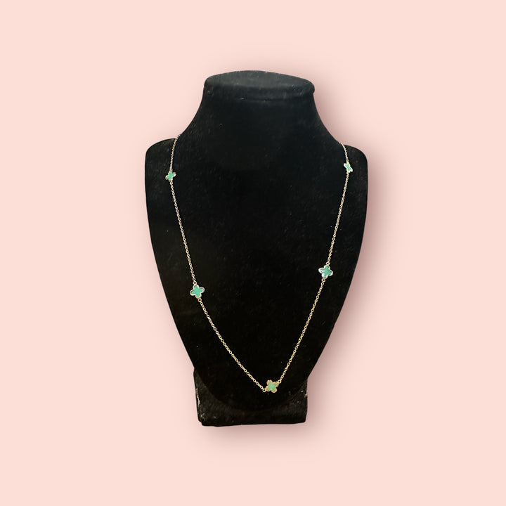Clover Linked Necklace: green clover pendants on a gold chain. Available in 16", 18", and 20" lengths.