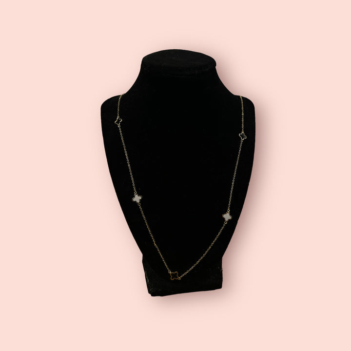 The Clover Linked Necklace: delicate gold chain, four white clover charms. Available in 16", 18", and 20" lengths.