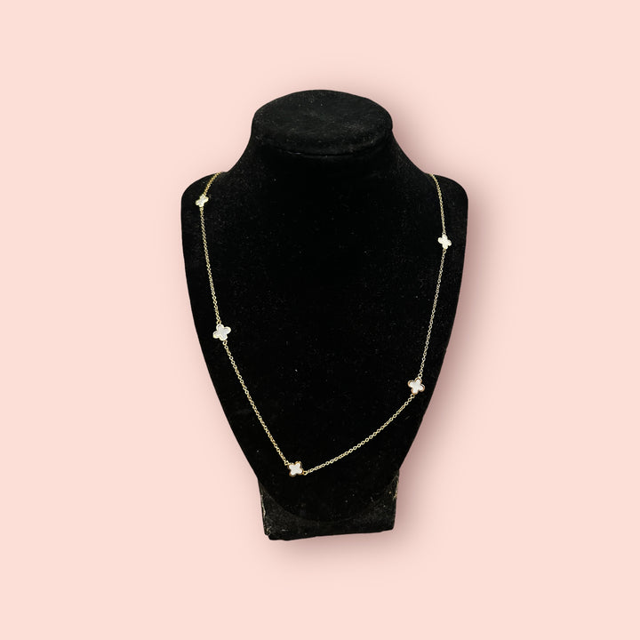 The Clover Linked Necklace: delicate gold chain with small clover charms. Available in 16", 18", and 20" lengths.
