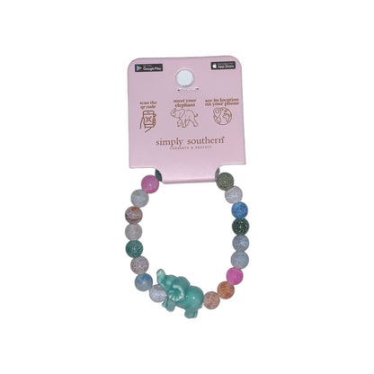 Multicolored bead bracelet with turquoise elephant charm, attached to pink info tag. Sizes available: one size fits most.