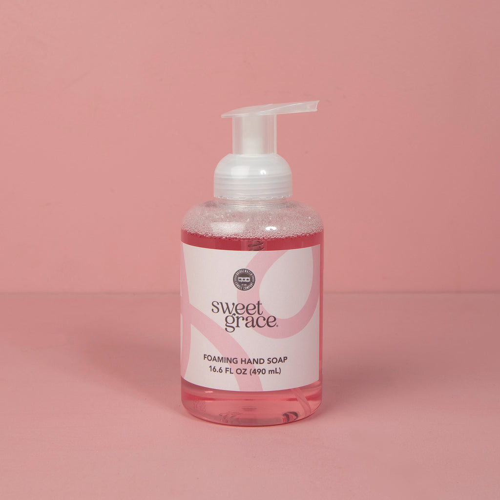 Sweet Grace Foaming Hand Soap, clear pump bottle, 16.6FL oz, pink liquid, white label with pink accents, aloe formula.