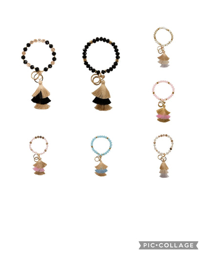 Eight Bead Bangle Crystal Keychains with tassel and ring charms in black, tan, pink, blue, white. Sizes: S/M/L/XL.