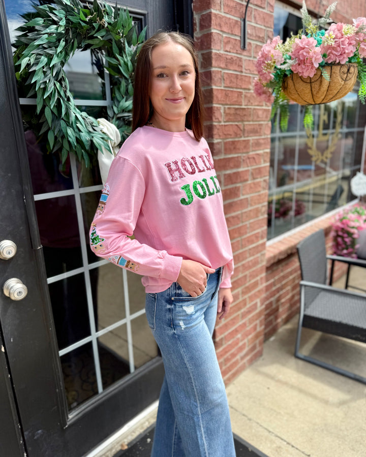 Pink Holly Jolly Sweatshirt, available in sizes S-XXL.