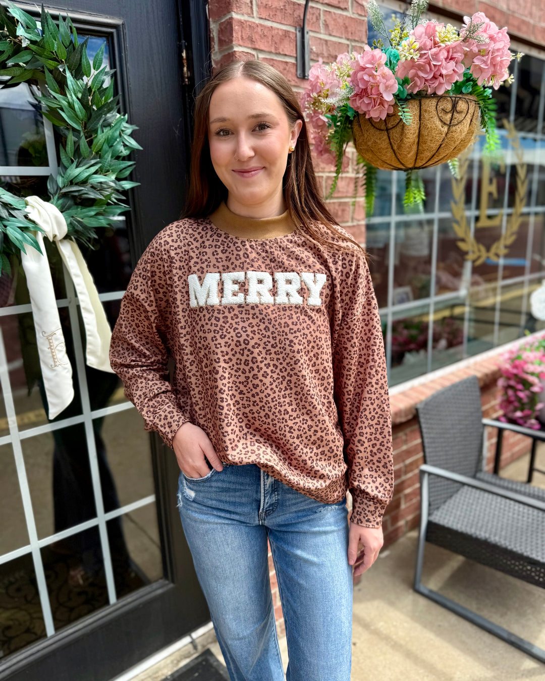 Leopard “Merry” mock neck available in sizes XS–XL.