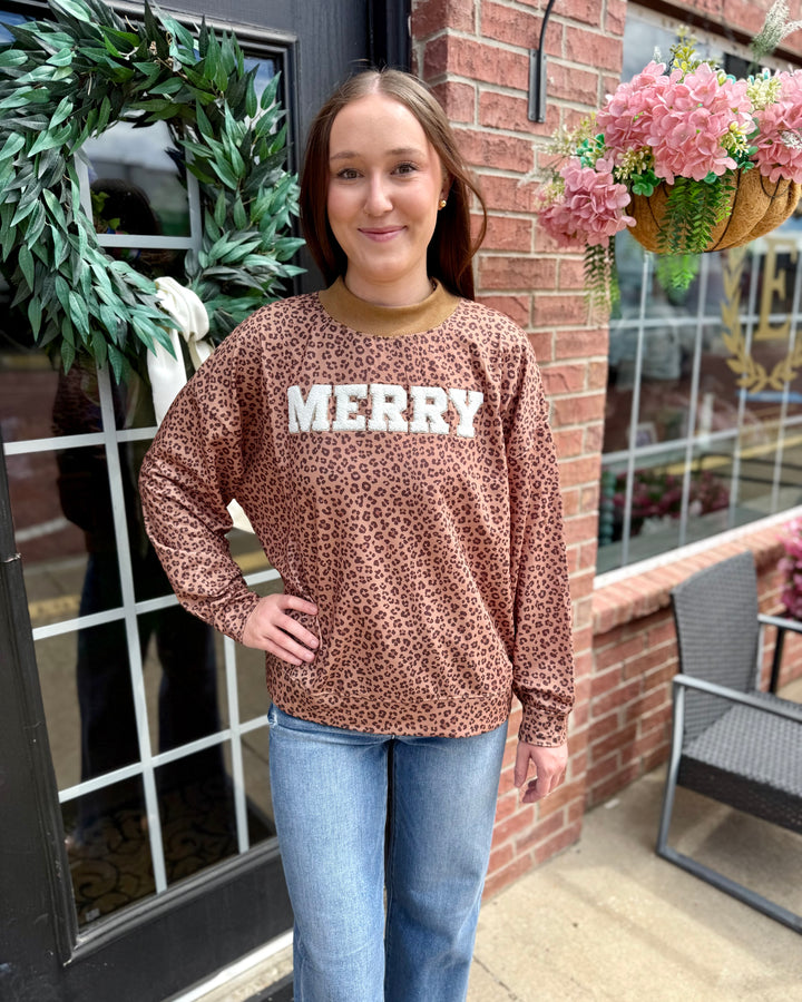 Leopard “Merry” Mock Neck, available in sizes XS-XL.