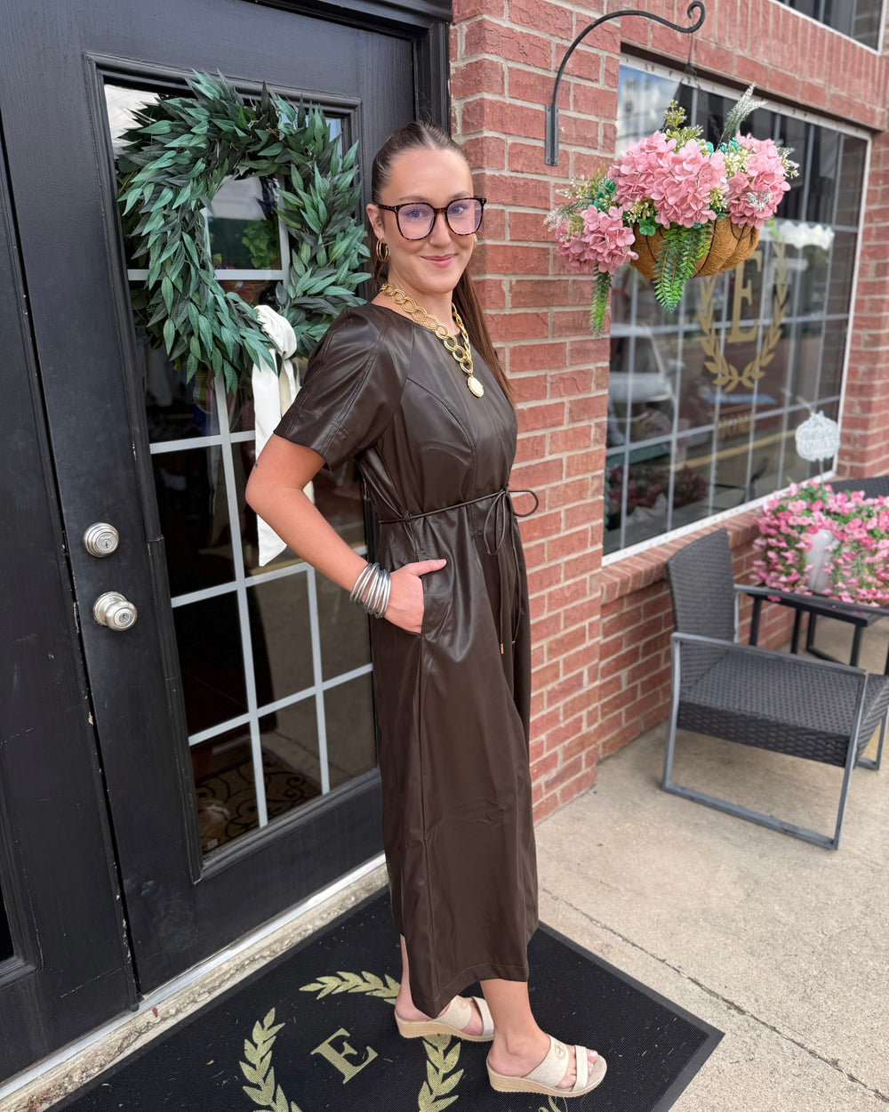 Brown faux leather waist-tie midi dress with pockets. Available in sizes XS–XL.