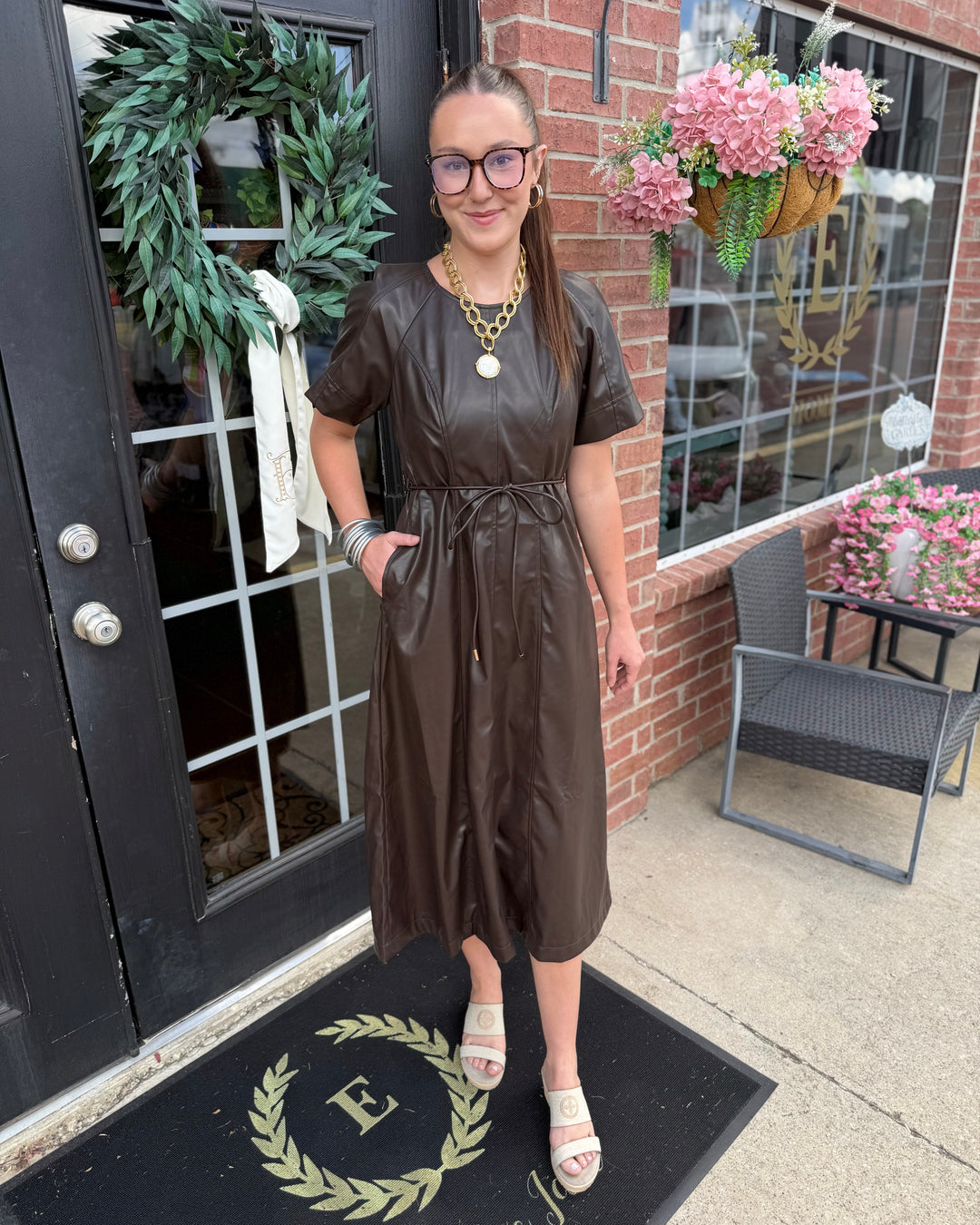 Brown Faux Leather Waist-Tie Midi Dress with side pockets. Available in sizes XS-XL.