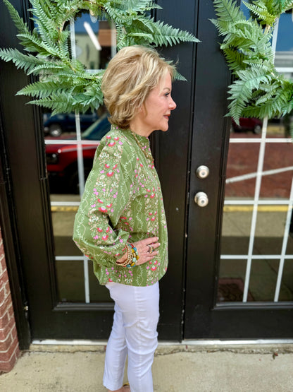 Lia Top: green floral blouse, quarter button collar, 3/4 puff sleeves. Available in XS–XL.