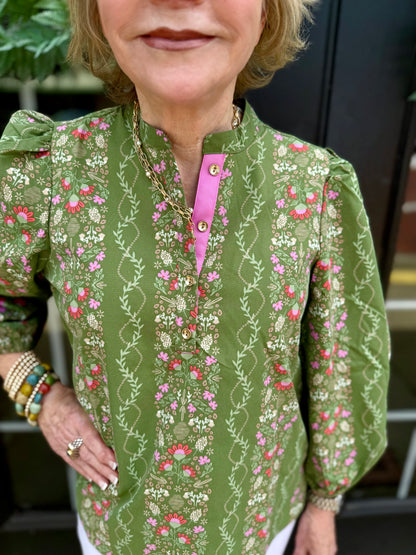 Lia Top: green with pink floral print, gold buttons, quarter collar, 3/4 puff sleeves. Available in XS-XL.