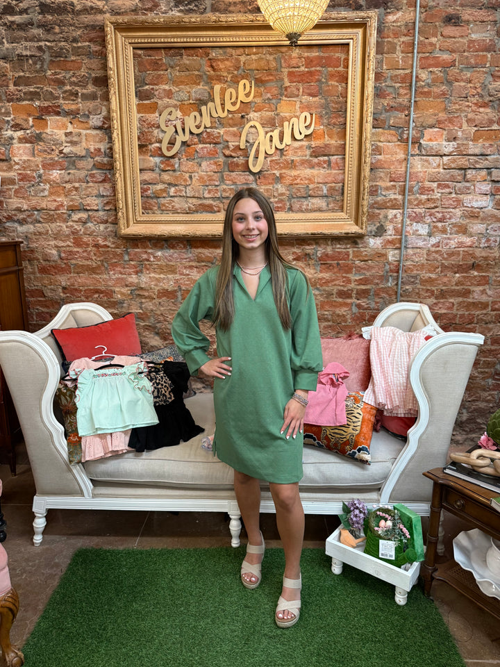 Hadley Green Dress in vibrant green, available in sizes XS-XL. Simple, elegant design showcased on model.