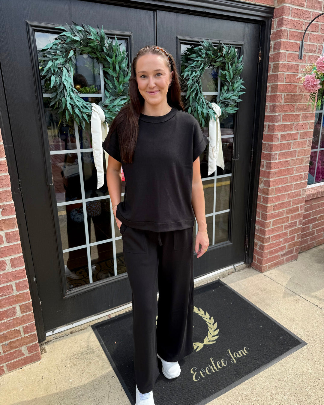 Black Scout Ribbed Set with short-sleeved top and wide-leg pocket trousers. Available in sizes S-L.