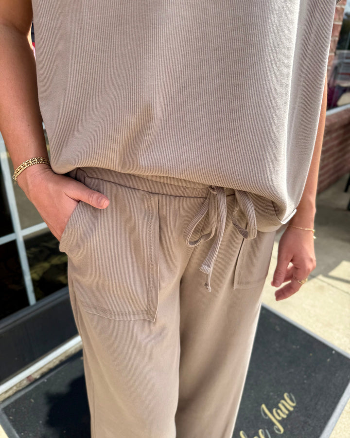 Beige Scout Ribbed Set with short-sleeved top and wide-leg drawstring pants with patch pockets.