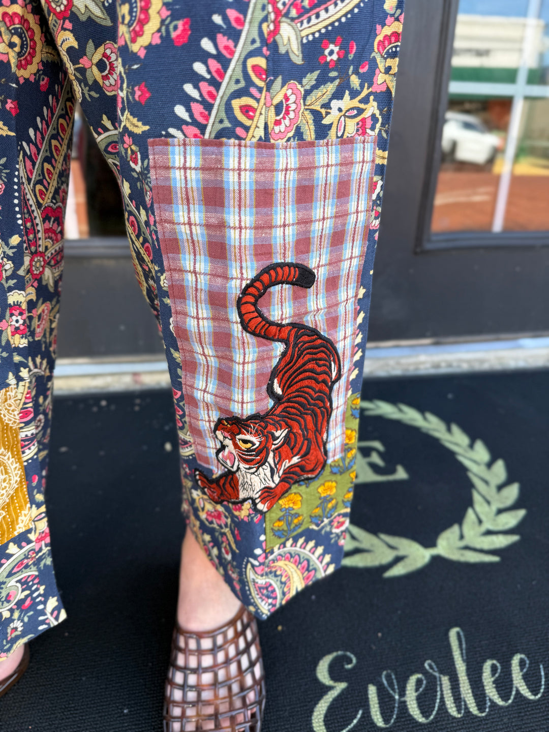 Navy blue Tiger Barrel Pant with colorful paisley, plaid-patchwork, and red tiger embroidery. Available in all sizes.