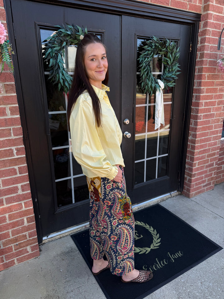 Tiger Barrel Pant: wide-leg floral pants in a dark blue, orange, and gold paisley pattern. Available in various sizes.