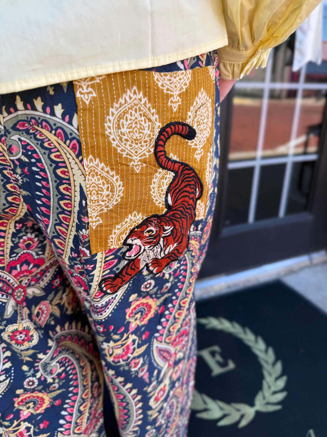 Navy and red paisley Tiger Barrel Pant with embroidered gold rectangular tiger patch pocket. Sizes available.