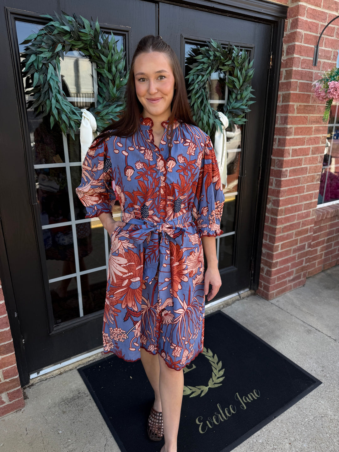 Blue floral print Scallop Trim Midi Dress with mandarin collar, elbow-length sleeves, waist tie, and scalloped hem. Available in multiple sizes.