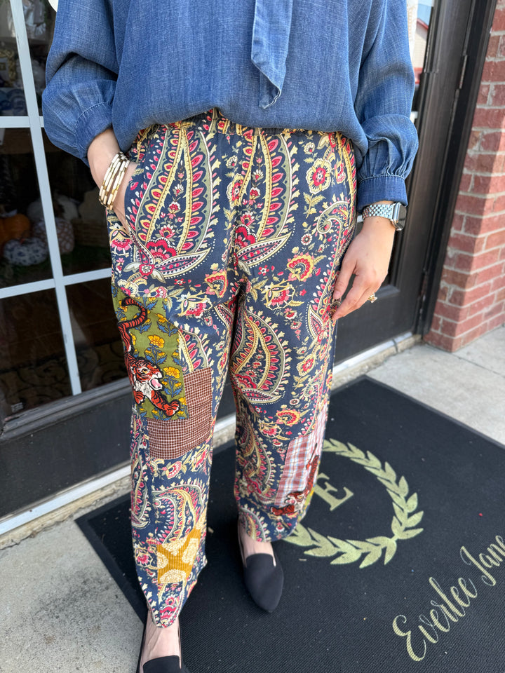 Tiger Barrel Pant in a loose-fitting navy paisley print with colorful patchwork panels and a tiger graphic. Sizes available: [Insert Sizes].