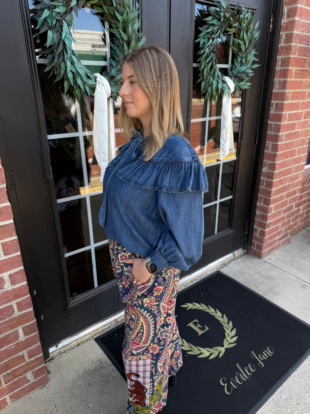 Tiger Barrel wide-leg pant with dark blue, red, and yellow paisley print and tiger graphic patch. Sizes available.