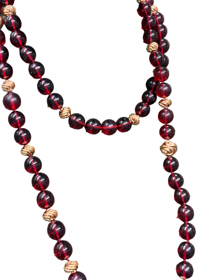 Ravello 5-in-1 Gold Necklace in cranberry, featuring multi-strand, adjustable length translucent deep red beads and textured gold-tone beads. Available in multiple sizes.