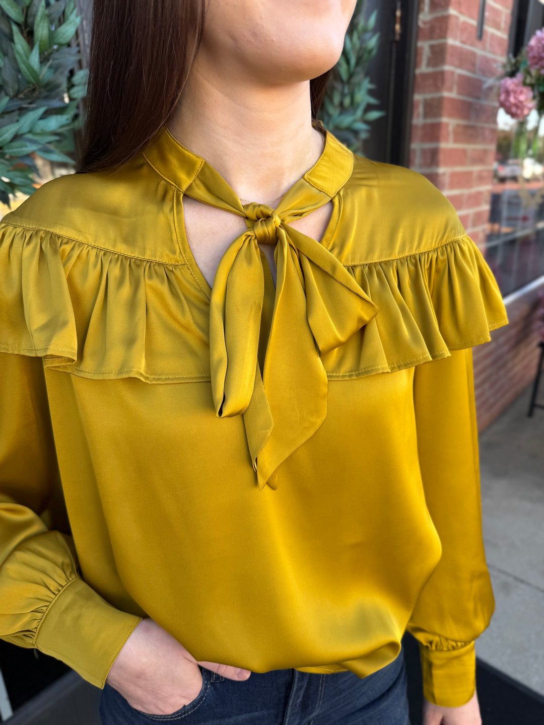 Chartreuse silky bow neck top with ruffled yoke and tied bow. Sizes available.