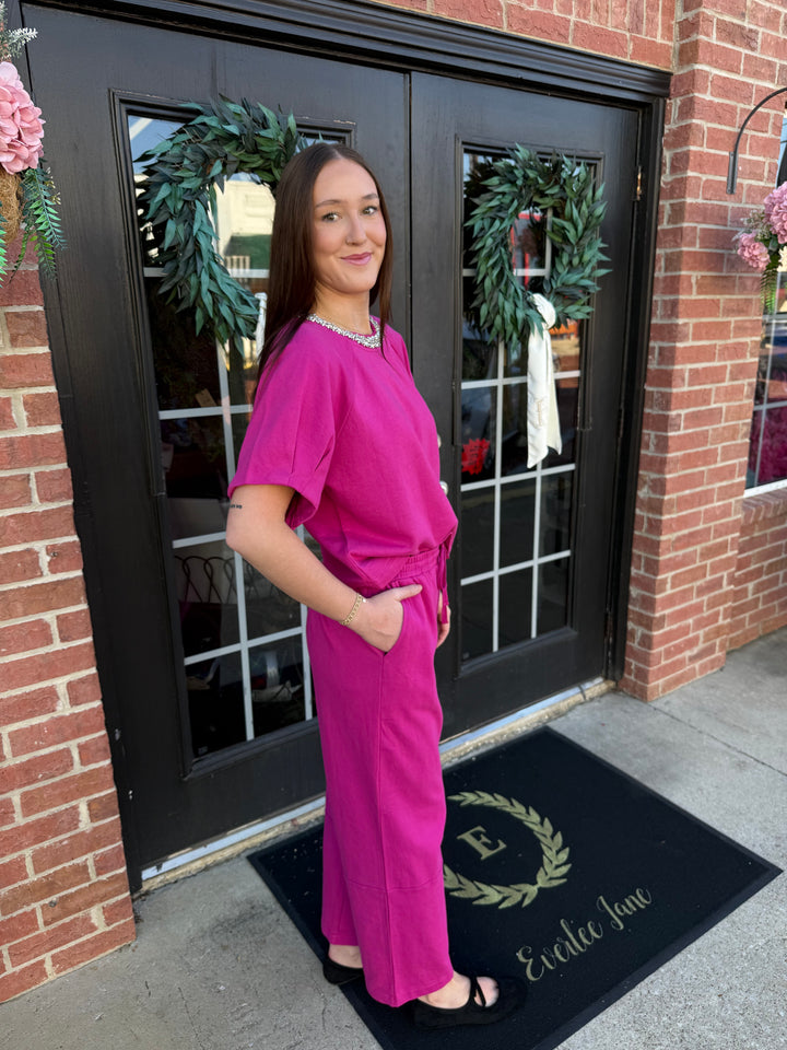 Fuchsia Sparkle Neck cotton top with rhinestone-embellished neckline and matching fuchsia wide-leg pants. Available in all sizes.