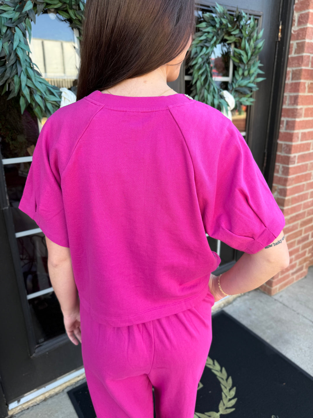 Fuchsia Sparkle Neck top, relaxed-fit cotton, crew neckline with subtle embellishment. Available in all sizes.