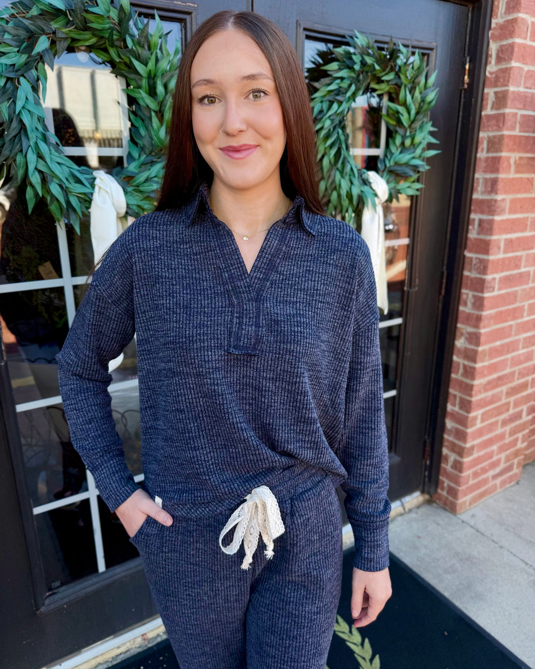 Dark blue Dusk Knit Cord V-Neck long-sleeve top with collar, ribbed texture, and relaxed fit.