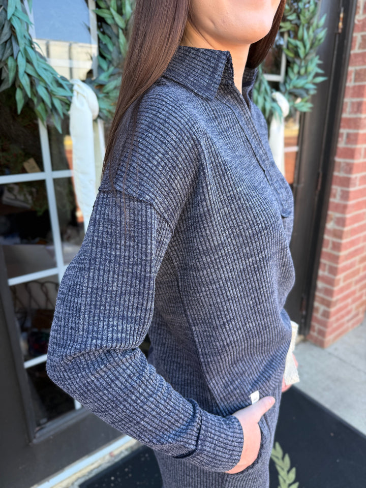 Dark gray Dusk Knit Cord V-Neck, ribbed long-sleeve, collared, relaxed fit. Available in all sizes.