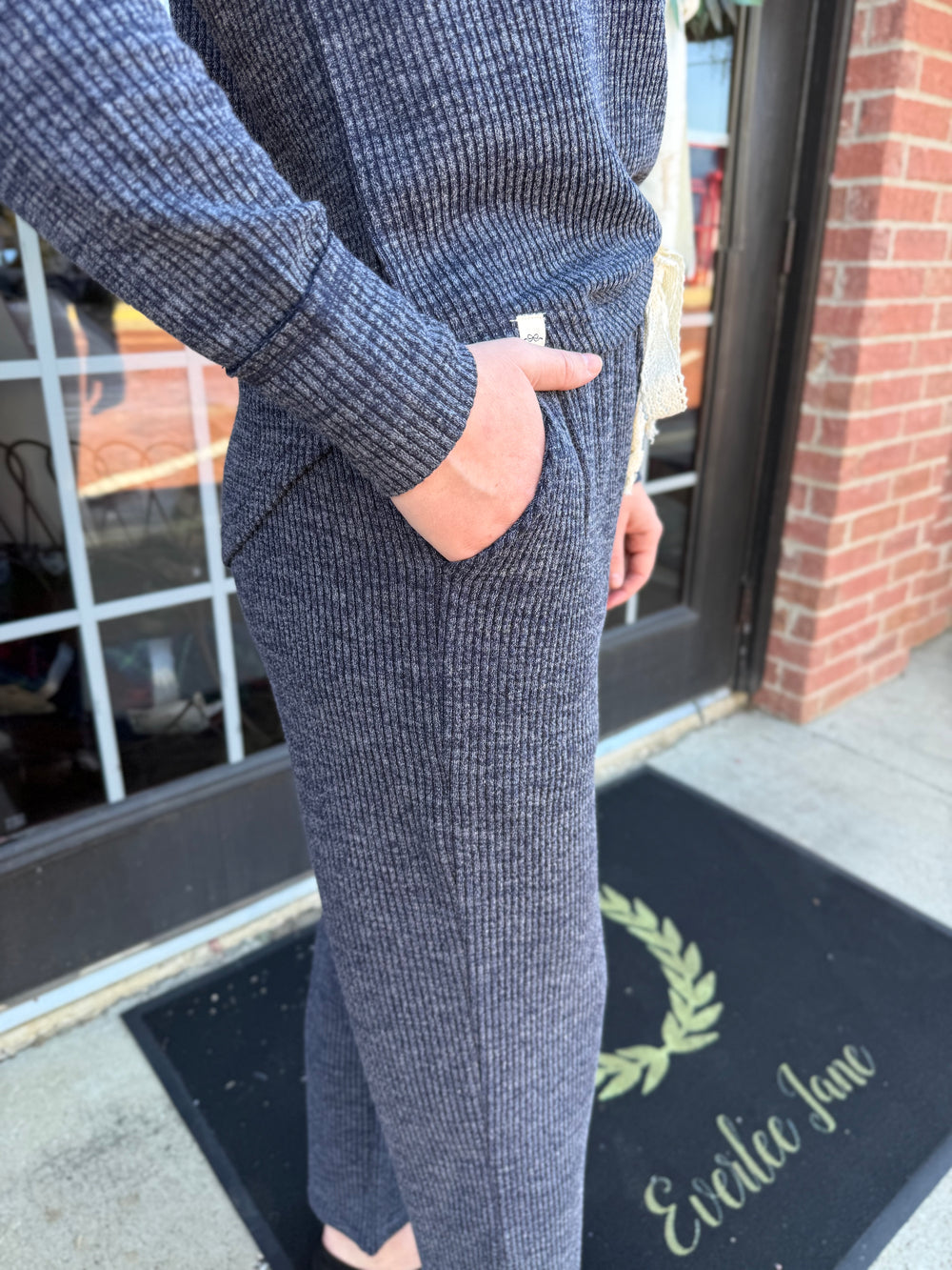 Dusk Knit Cord Pant in dark grey, straight-leg, ribbed knit, side pocket, elastic drawstring waistband. Available in all sizes.