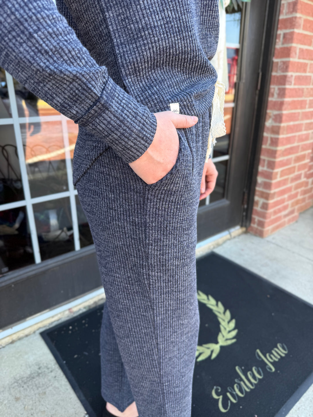 Dusk Knit Cord Pant in dark grey, straight-leg, ribbed knit, side pocket, elastic drawstring waistband. Available in all sizes.