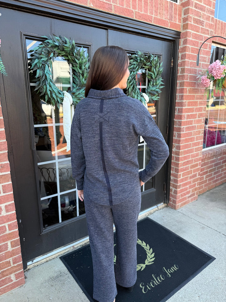 Dusk Knit Cord V-Neck: dark grey long-sleeve knit V-neck cord top with a back seam and matching wide-leg relaxed-fit pants.