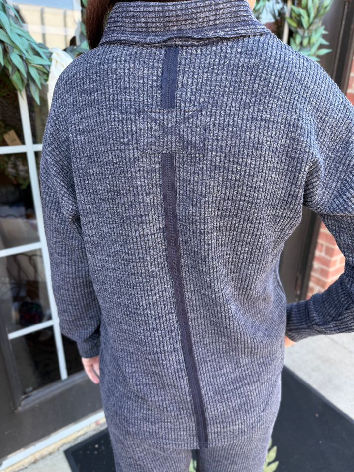 Dusk Knit Cord V-Neck sweater in dark grey, relaxed fit, vertical back seam, folded collar. Available in various sizes.