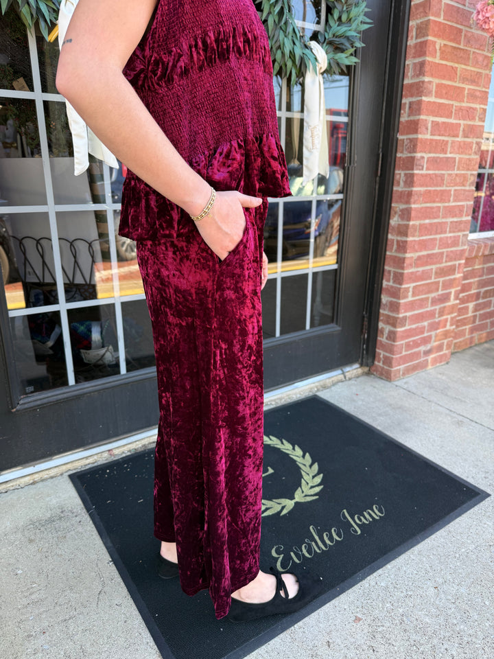 Cranberry Velvet Smocked Wide Leg Pant in cranberry velvet with a wide-leg silhouette, smocked waistband, and side pockets.