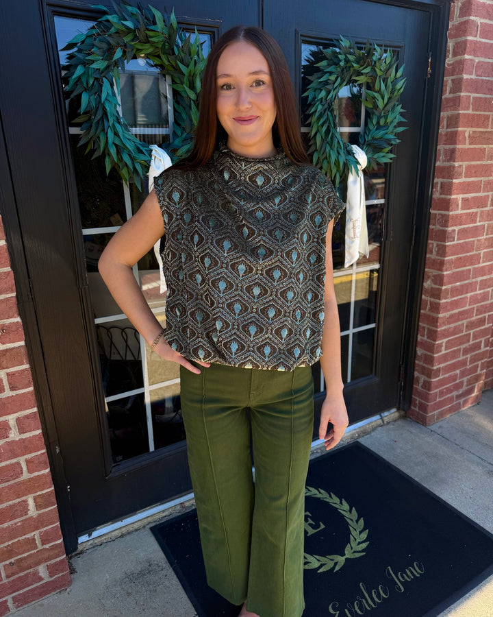 Sage velvet mock neck top in sage green with cap sleeves, teal and black geometric pattern, and bubble silhouette. Available in various sizes.
