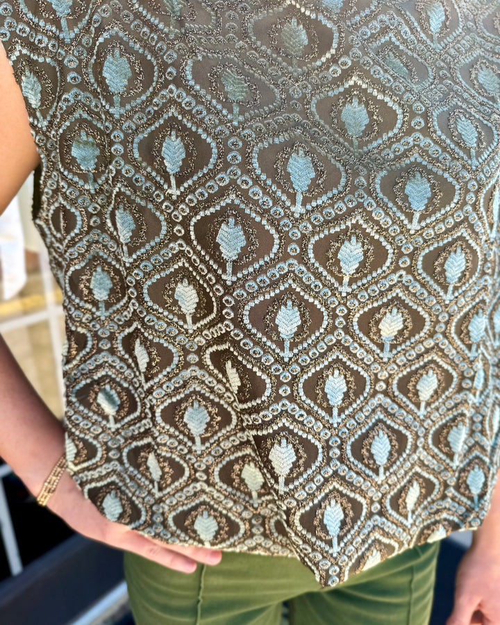 Sleeveless sage velvet mock neck top with metallic gold geometric diamond pattern and bubble silhouette.