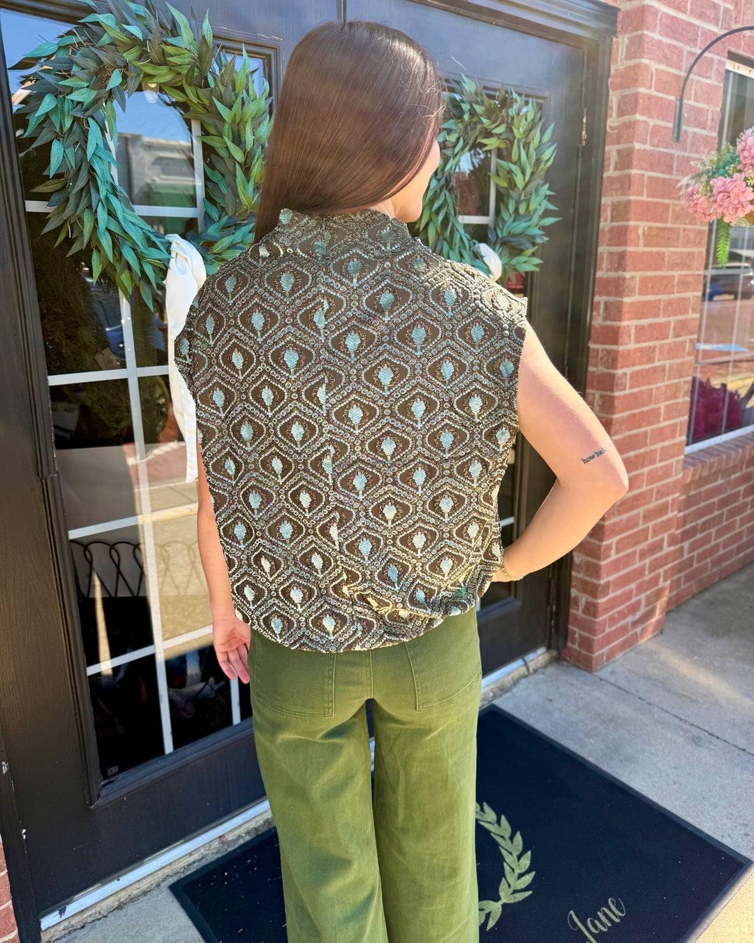 Sage Velvet Mock Neck Top in a brown and blue geometric pattern, sleeveless, bubble silhouette. Available in various sizes.