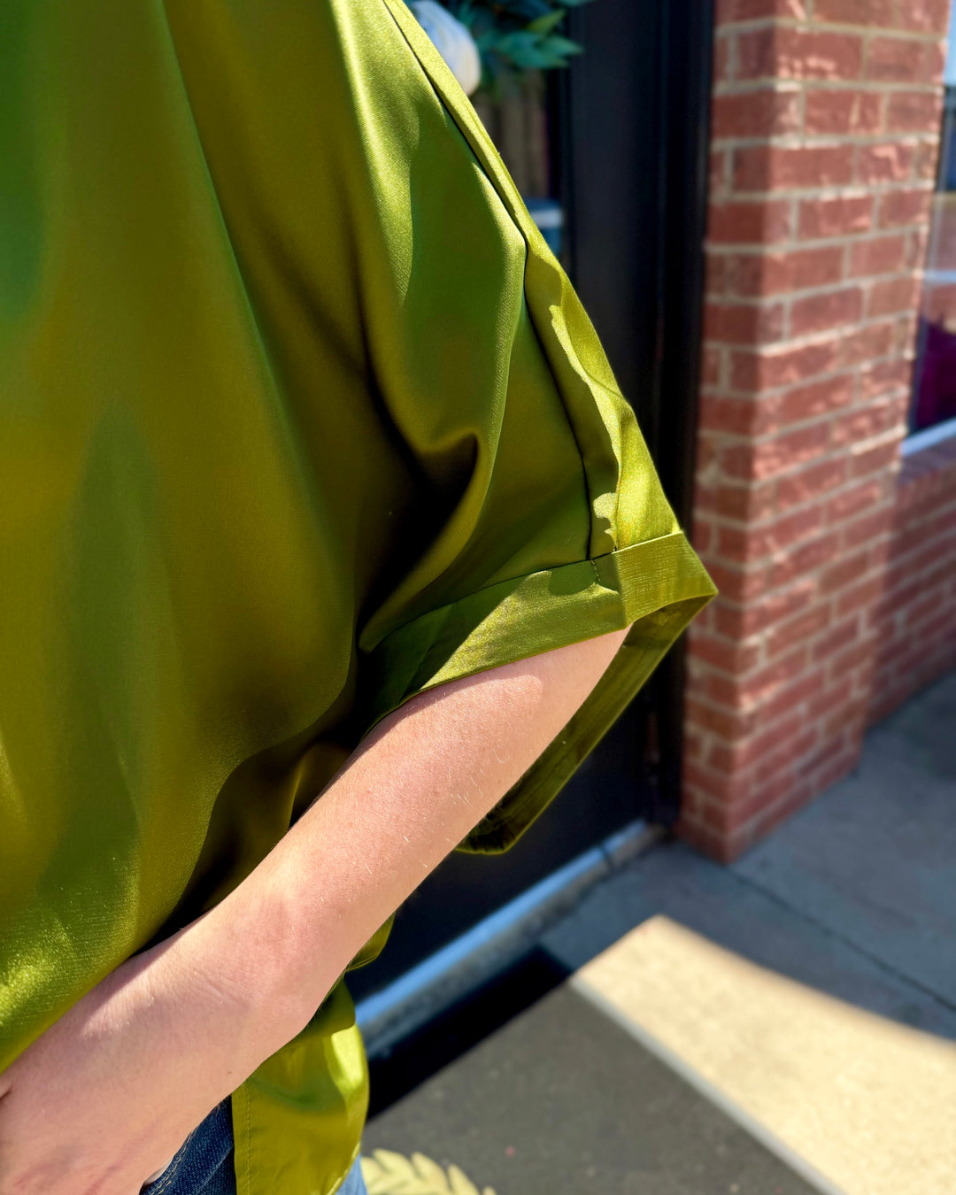 Olive green oversized satin mock neck top with cuffed short sleeves. Available in all sizes.