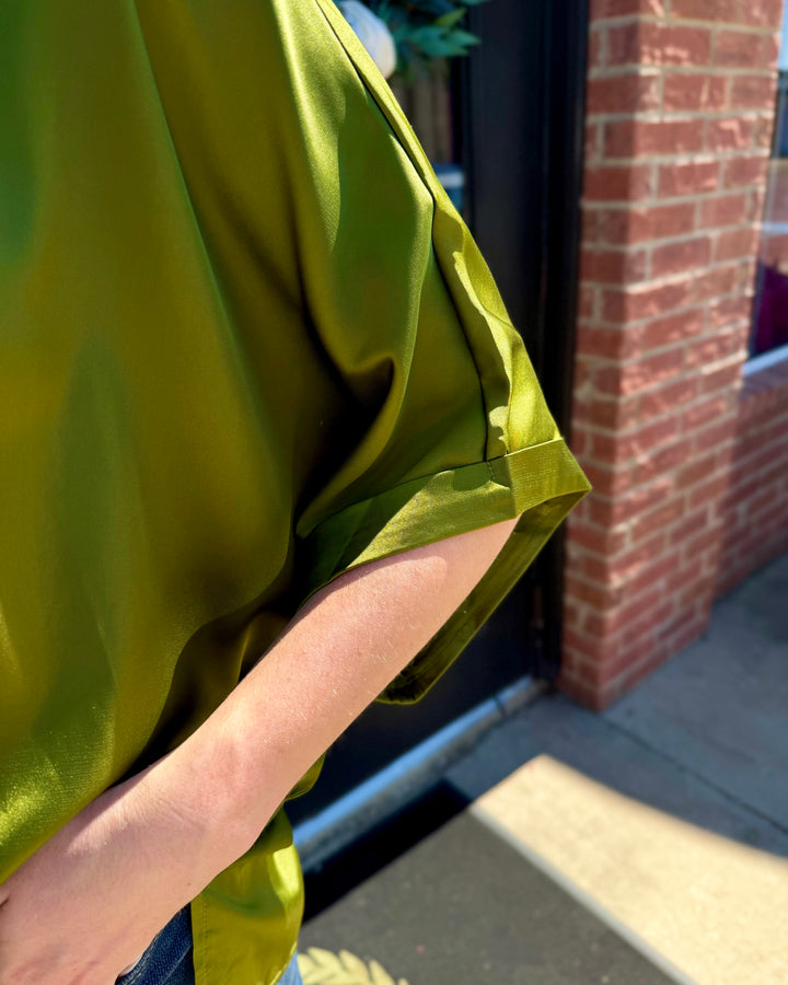 Olive green oversized satin mock neck top with cuffed short sleeves. Available in all sizes.
