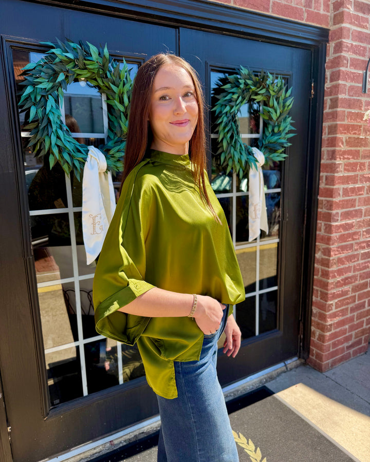 Olive green mock neck oversized satin top with elbow-length sleeves. Available in all sizes.