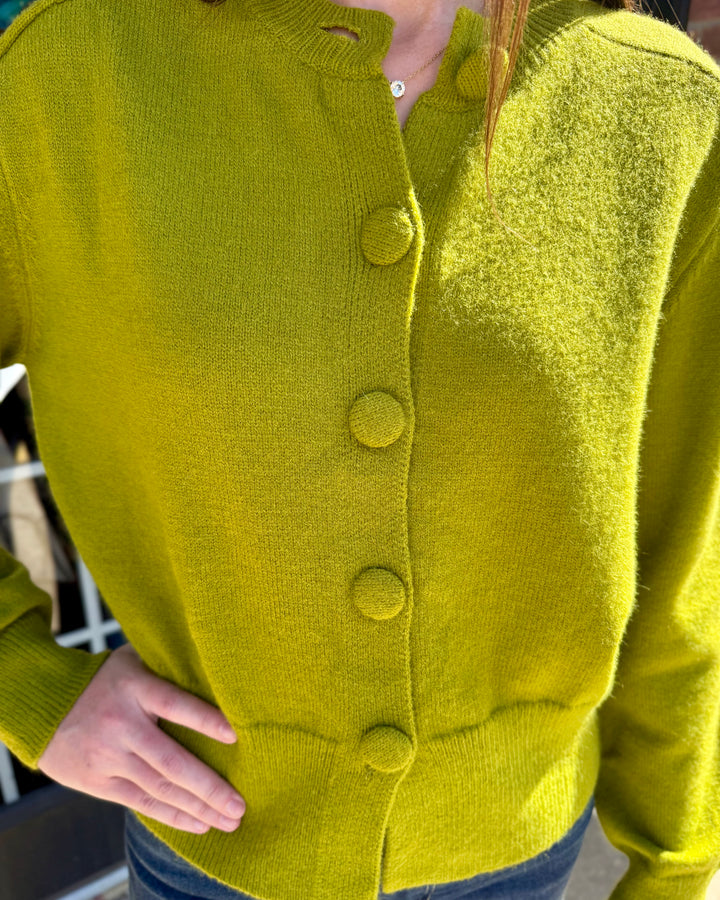 Chartreuse long-sleeve crew neck button-up cardigan with ribbed hem. Available in multiple sizes.
