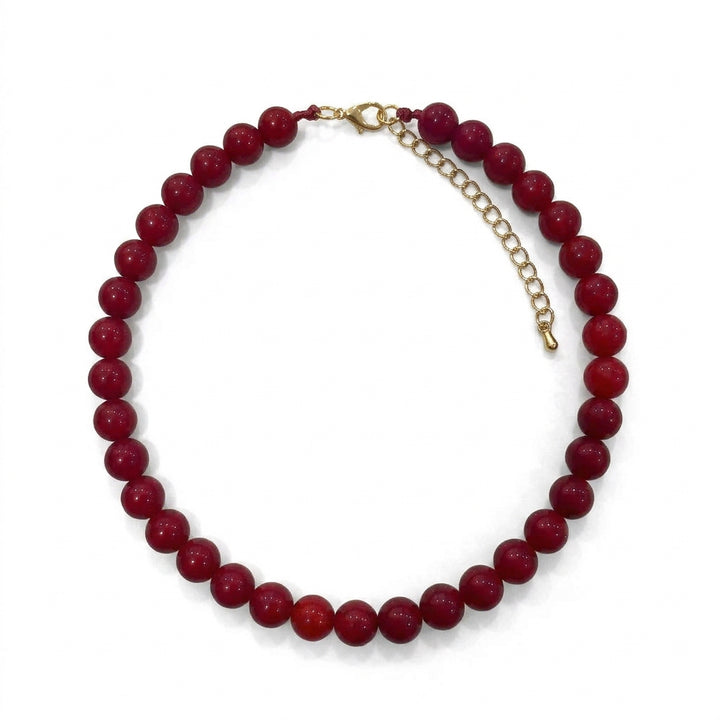 Sunset Beaded Necklace with a pink and red gradient, lobster clasp, and extender chain. Available in adjustable sizes.