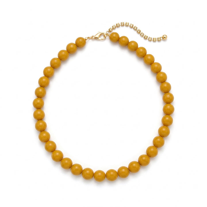 Sunset Beaded Necklace with tan and brown round beads, silver-tone clasp, and extender chain.