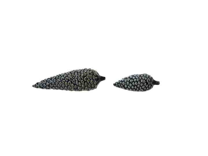 Two blue stoneware pinecones in two sizes.
